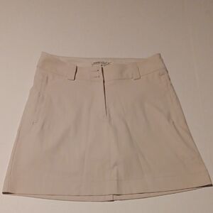 NIKE GOLF CREAM SKORT SIZE 2/S